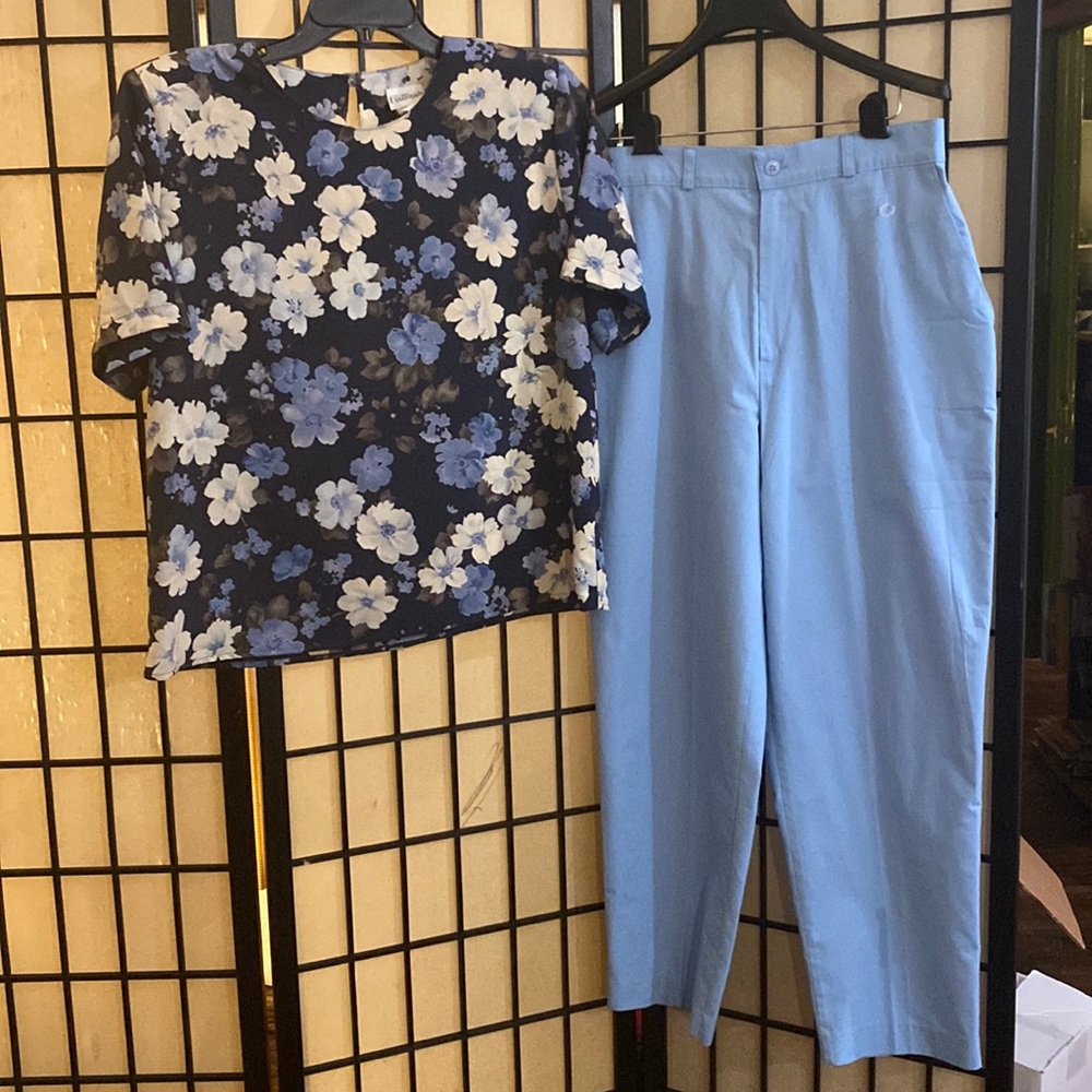 Two piece Vintage outfit including high waisted blue pants and floral top